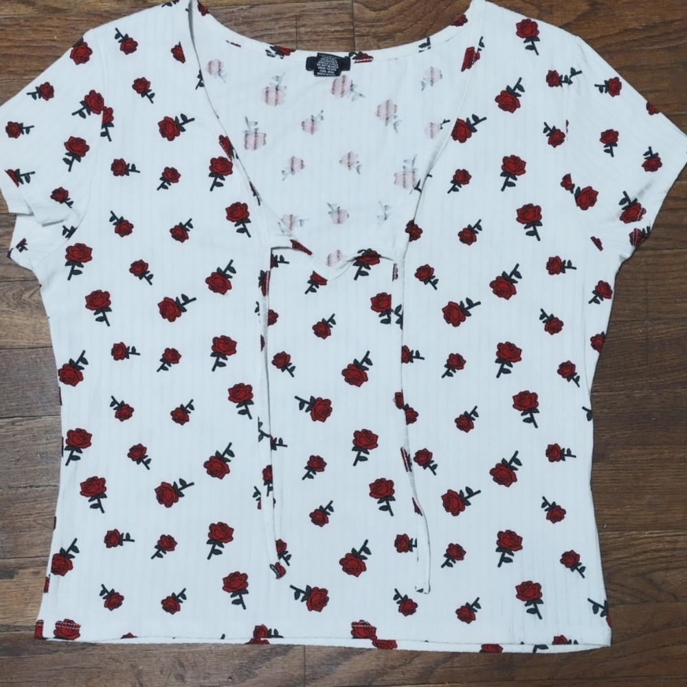 White tank top, red roses and two laces in the front; from rue21